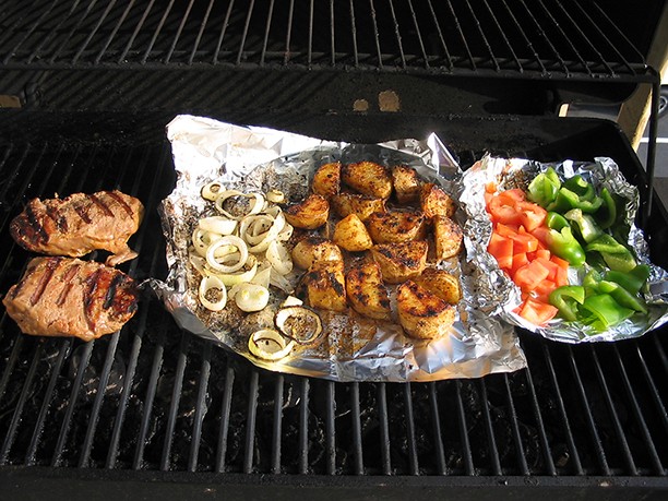 food cooking on a grill